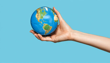 Contemporary art collage of a hand holding the globe against a blue background