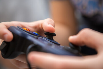 boy's hands with gamepad close up
