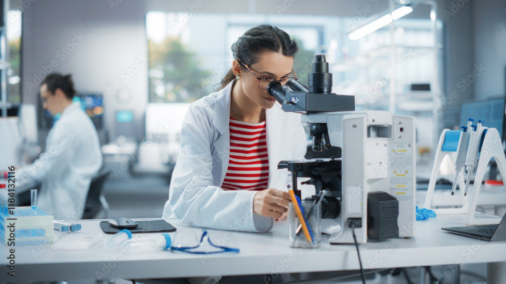 Poster portrait of a smart female student working on laptop on a research project in school. medical resear