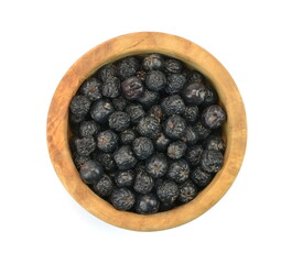 Aronia berries in a wooden bowl isolated against white background. Black chokeberry or aronia berries, isolated on white background, can be used to make wine, jam, syrup, juice, soft spreads,