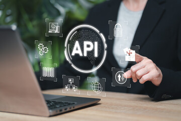 API, Application Programming Interface concept, Businesswomen use laptops and software development tools to process the interface between server and web browser, Modern technology and networking