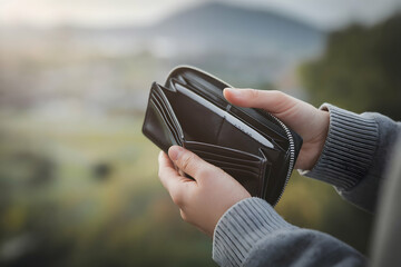 Hands hold empty wallet focused simplicity conveys financial struggle