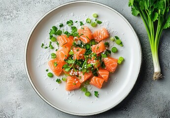 Sashimi salmon plate with green onions and black sesame on a gray background