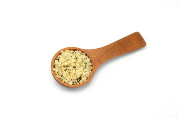 Shelled Hemp Seed in a wooden spoon isolated on white. Hemp hearts isolated - Healthy Nutrition