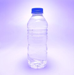 Naklejka premium A bottle filled with drinking water background blue