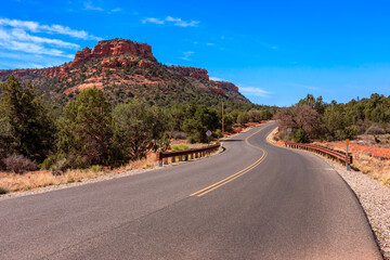 A road with a mountain in the background