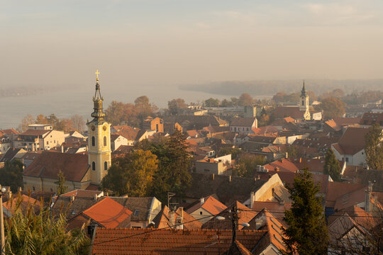 Zemun old town rooftops and church tower in morning haze and fog, Belgrade, Serbia