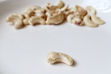 Cashew nut seed snack fruit on white background
