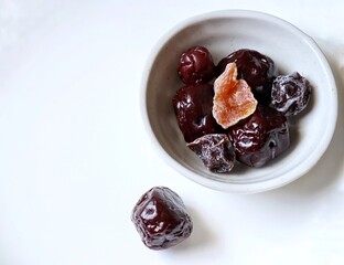 Dried plums fruit on white background Chinese dessert