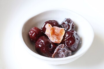 Dried plums fruit on white background Chinese dessert