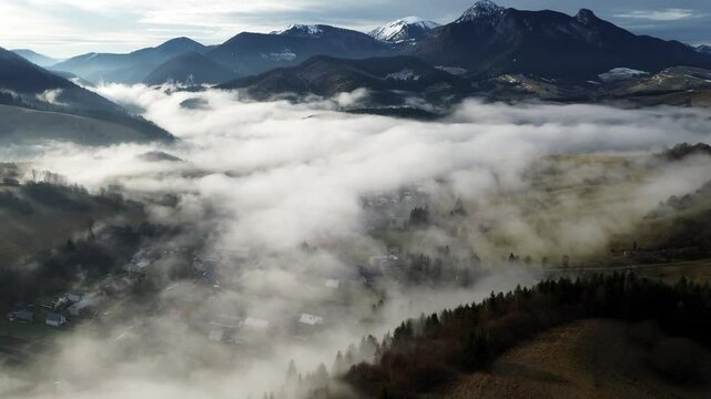 Aerial View of a Beautiful Misty Village in the Valley of the Carpathian Mountains, Slovakia