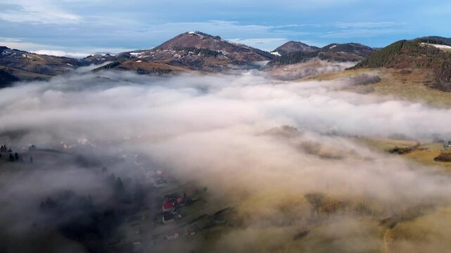 Aerial View of a Beautiful Misty Village in the Valley of the Carpathian Mountains, Slovakia