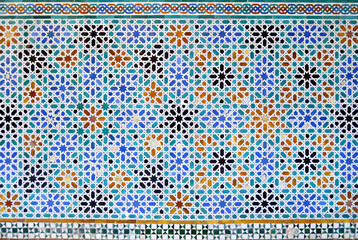 Mosaic tiles in Patio de las Doncellas (Courtyard of the Maidens) in Alcazar of Seville, Andalusia, Spain. Mudejar Palace of Reales Alcazares. Azulejos alicatados of Al Andalus