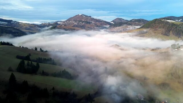 Aerial View of a Beautiful Misty autumn Village in the Valley of the Carpathian Mountains, Slovakia
