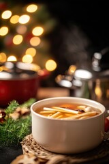 Obraz premium A Warm Bowl of Kaeng Nor Mai Soup featuring Bamboo Shoots and Fresh Herbs, Perfectly Captured in a Cozy Setting with Bokeh Lights