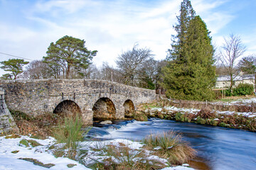 Fototapeta premium Dartmoor winter snow scene showing Postbridge in the Dartmoor national park. 