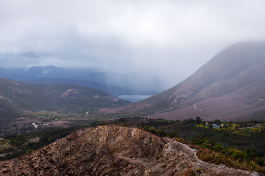 Landscape view of an old open cut mine on a cloudy day, Tasmania