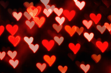 St Valentines Day heart bokeh background, red shining hearts, St Valentines day background with glowing hearts