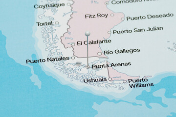 Macro photo of a white pin needle into Punta Arenas city of Chile political map