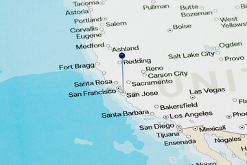 Macro photo of a blue pin needle into San Jose city of United States of America political map 