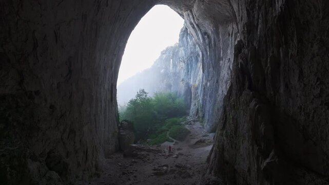 Aerial view of prohodna cave at sunrise with dramatic rock formations and beautiful landscape, Karlukovo, Bulgaria.