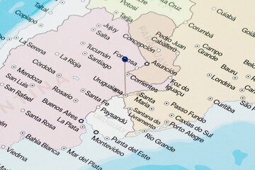 Macro photo of a blue pin needle into Uruguaiana city of Brazil political map 