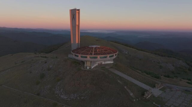 Kran, Bulgaria - 01 December 2024: Aerial view of the abandoned buzludzha monument at sunrise surrounded by mountains, Kran, Bulgaria.