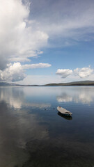 A small boat at beach of Urla, izmir. beautiful clouds