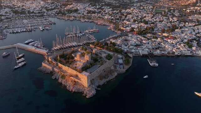 Aerial view of bodrum castle at sunset overlooking the aegean sea and harbor, bodrum, turkey.