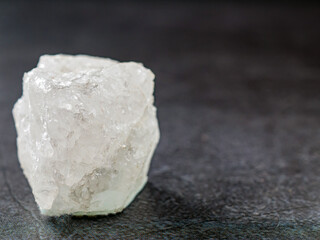 Close-up of quartz mineral on gray background