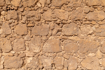 Stone wall of the Byzantine Church ruins at Masada National Park in southern Israel.
