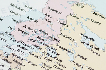 Macro photo of a white pin needle into Joensuu city of Finland political map 