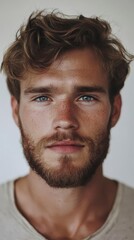 Intense Gaze: A Portrait of a Young Man with a Beard