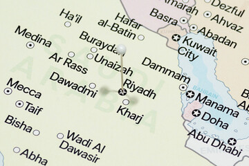 Fototapeta premium Close up to a white pin needle into Riyadh city of Saudi Arabia political map 