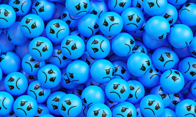 Blue Monday concept with a pile of blue sad face balls