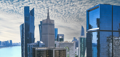 Doha Qatar - February 2024. Business district buildings skyline. Modern glass skyscrapers background