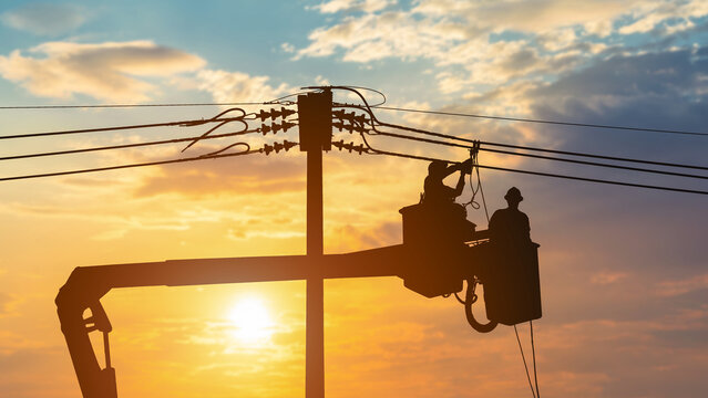 Electrician working at height on crane. High voltage system.