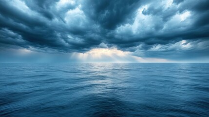 Obraz premium Dramatic Seascape with Dark Storm Clouds and Rays of Light Breaking Through