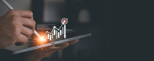businessman trading in stock market exchange on virtual screen in office workplace signing investment documents and money management with trading chart financial planning for saving and passive income