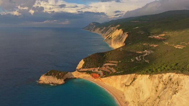 Aerial view of porto katsiki beach at sunset with scenic cliffs and tranquil waters, lefkada, greece.