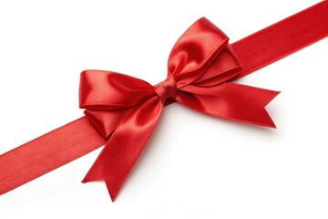 A vibrant red satin ribbon tied in a perfect bow, elegantly arranged on a pristine white background