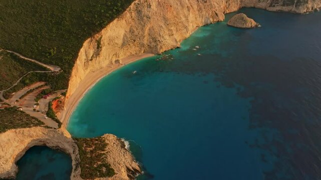 Aerial view of porto katsiki beach with turquoise water and stunning sunset glow, Lefkada, Greece.