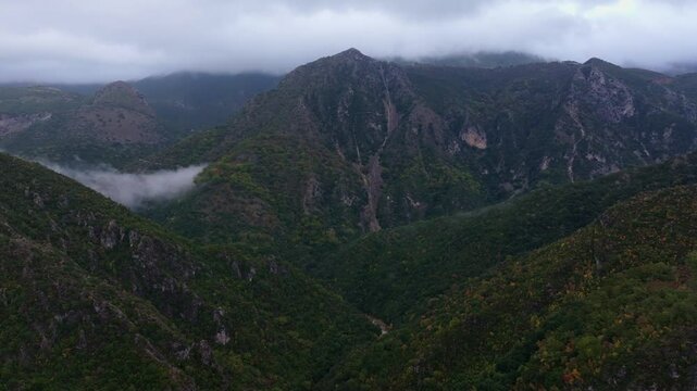 Aerial view of Acheron Springs with lush greenery and rugged mountains, Epirus, Greece.
