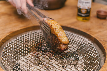 A piece of meat is on a metal pan
