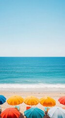 A vibrant beach scene featuring colorful umbrellas lining a sandy shore with tranquil ocean waves under a clear blue sky.