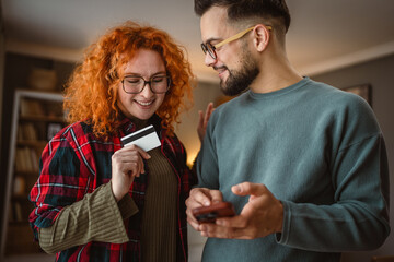 boyfriend and girlfriend use cellphone and credit card shopping online