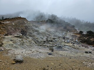 The Sikidang crater is in the Dieng Plateau in East Java. It's a sulfur crater that's still active and a natural tourist destination in Indonesia.