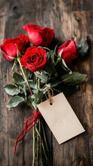 Beautiful Bouquet of Red Roses Tied with a Rustic Tag on Wooden Backdrop