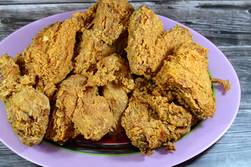 Pieces of broasted chicken meal, a broast chicken pieces, Broasting is a special cooking process that combines pressure frying and traditional shallow frying to produce juicy chunks of fried chicken