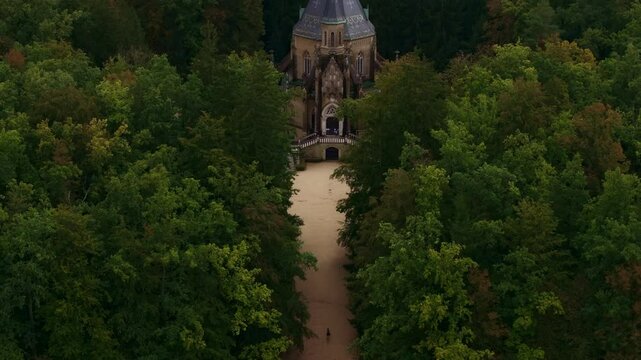 Aerial view of the historic schwarzenberg tomb surrounded by serene forest and pathway, Trebon, Czech Republic.